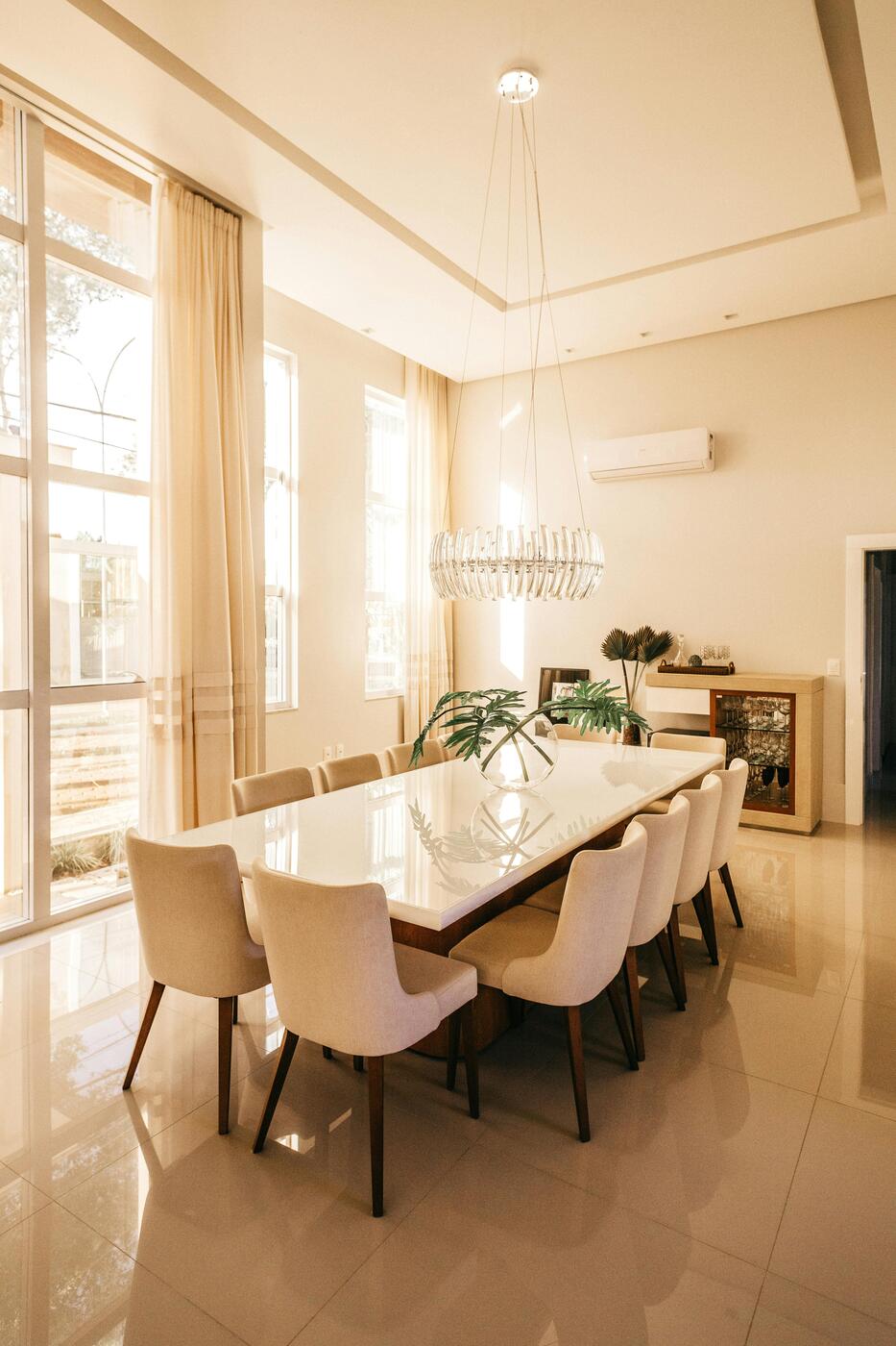 Elegant dining room with warm cream painted walls and tall ceilings